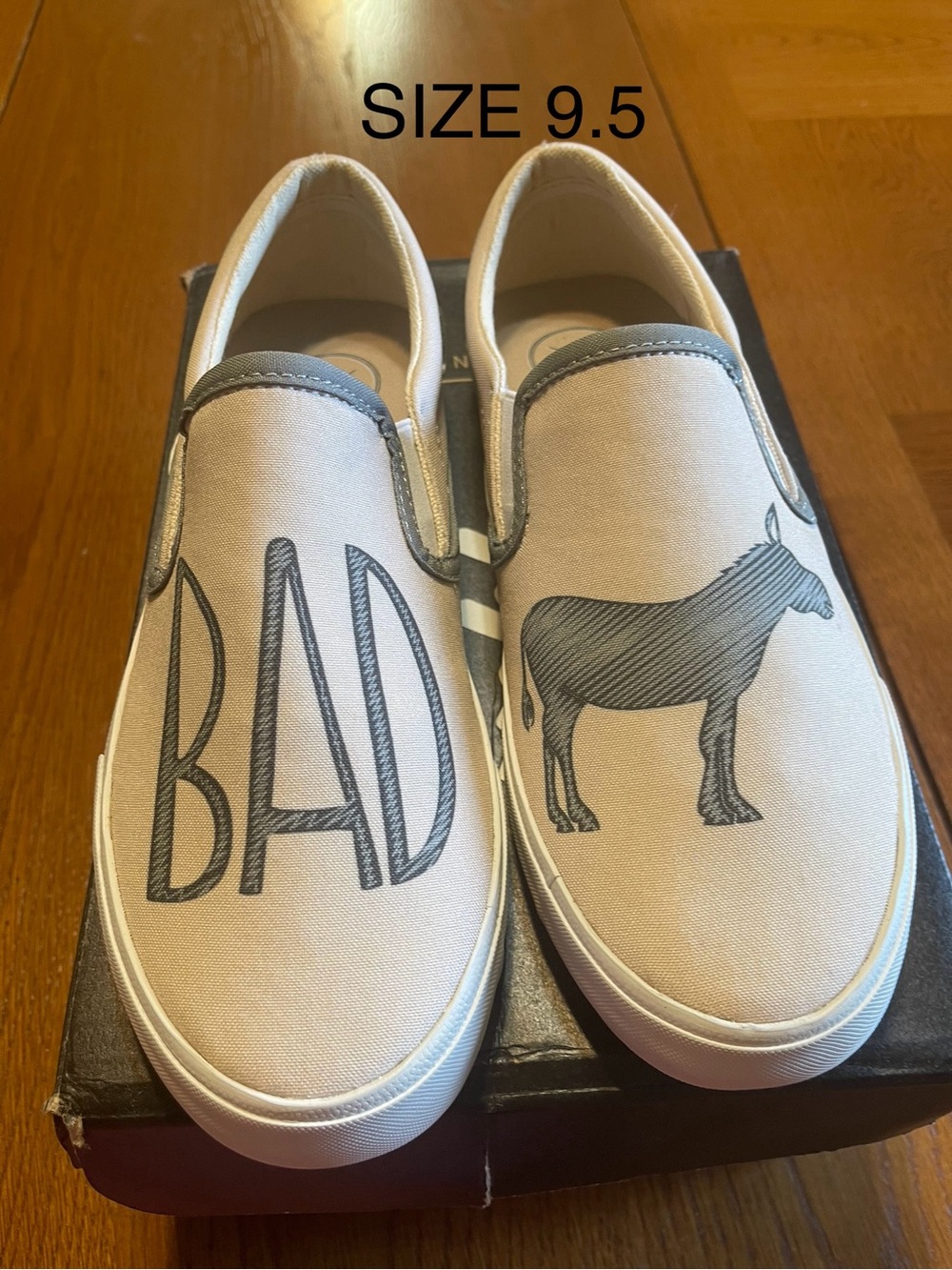 inkkas Beige Slip-On Sneakers with Black Donkey Graphic